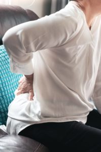 Woman Experiencing Lower Back Pain From Sciatica