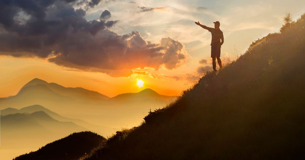 happy man standing on mountain