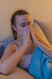 woman experiencing pain from sinusitis